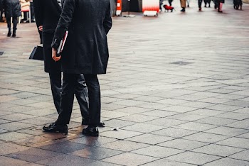 Photo of People Standing on Street