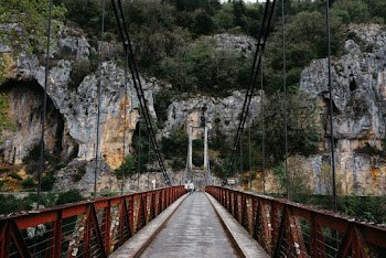 Photo of People Standing on Suspension Bridge