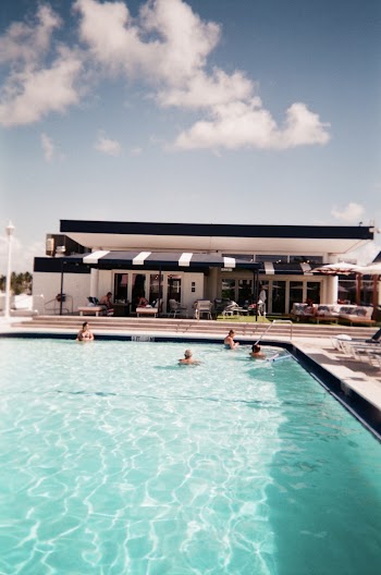 Photo of People Swimming in Pool