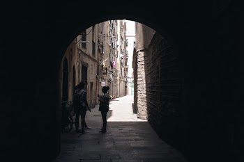 Photo of People Talking in the Street