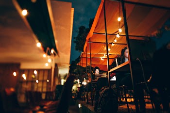 Photo of People Using Their Laptops and Computer During Night