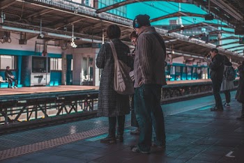 Photo of People Waiting at Train Station