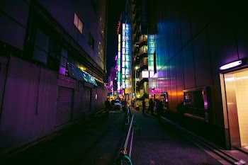 Photo of People Walking In Alley
