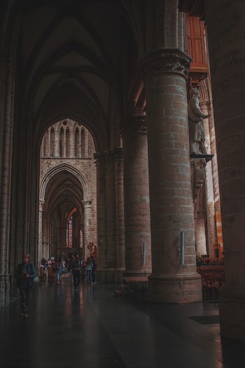 Photo of People Walking in Hallway