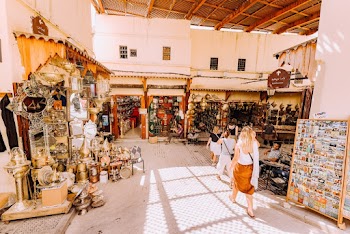 Photo of People Walking in Marketplace