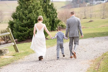 Photo of People Walking in Unpaved Road