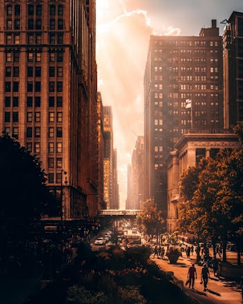 Photo of People Walking Near Buildings