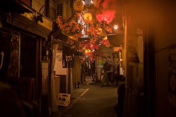 Photo of People Walking on Alleyway