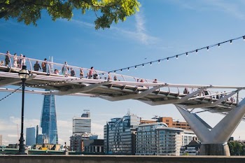 photo of people walking on bridge