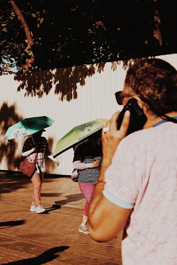 Photo of People Walking on Pavement