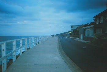 Photo of People Walking on Sidewalk