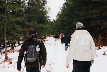 Photo Of People Walking On Snow