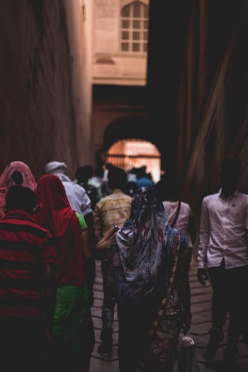 Photo of People Walking Towards Gate