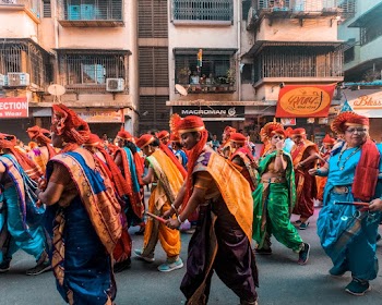 Photo of People Wearing Traditional Clothes