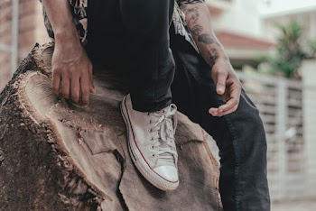 Photo of Person's Foot on Tree Stump