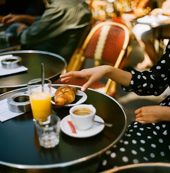 Photo of Person's Hand Getting a Bread