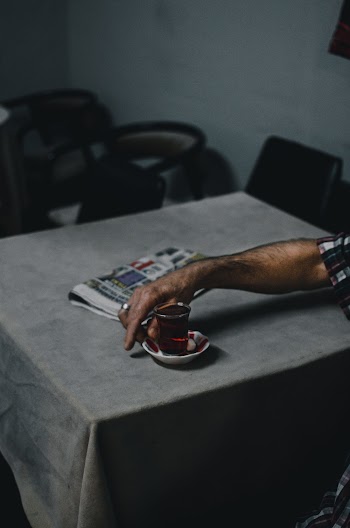 Photo of Person's Hand Holding a Teacup