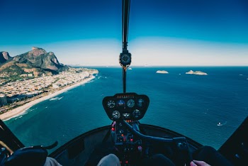 Photo of Person Flying a Helicopter