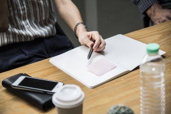 Photo of Person Holding a Pen 