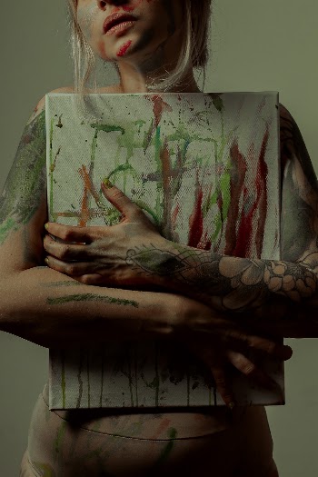 Photo of Person Holding Abstract Painting