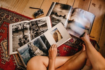 Photo Of Person Holding Books