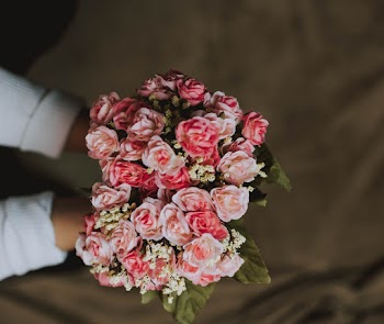 Photo Of Person Holding Bouquet