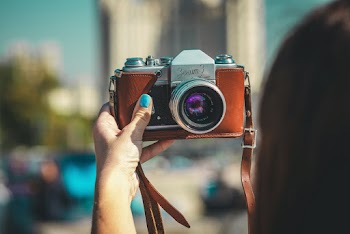 Photo of Person Holding Camera