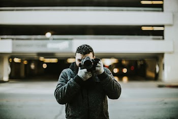 Photo Of Person Holding Camera