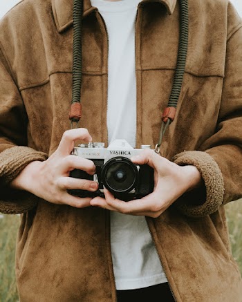 Photo Of Person Holding Camera