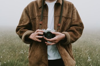 Photo Of Person Holding Camera