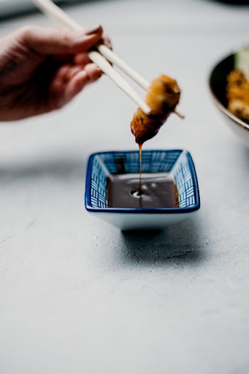 Photo Of Person Holding Chopsticks