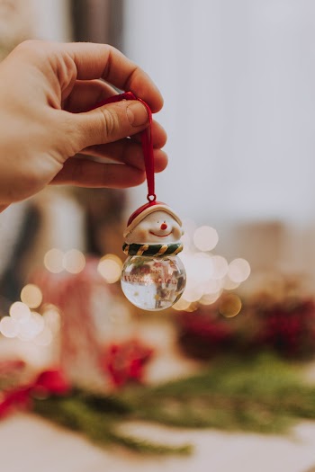 Photo Of Person Holding Christmas Decor