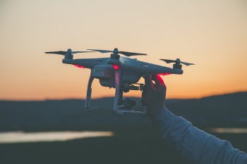 Photo of Person Holding Drone