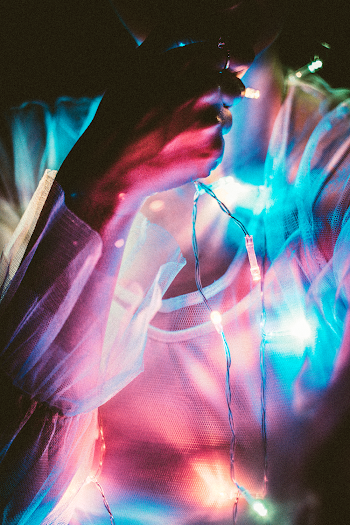 Photo of Person Holding Fairly Lights