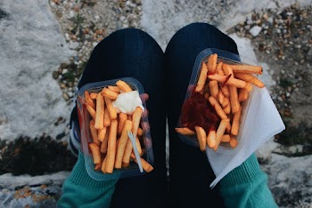 Photo Of Person Holding Fries