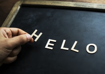 Photo of Person Holding H Cutout Decor