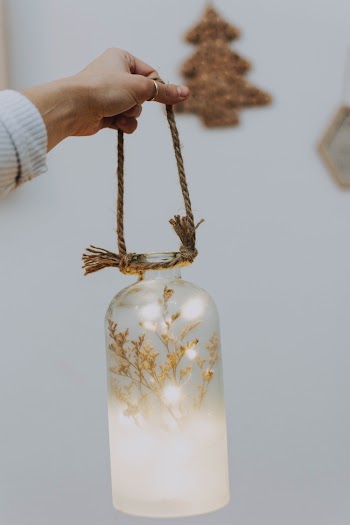 Photo Of Person Holding Jar 