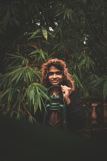 Photo Of Person Holding Lamp