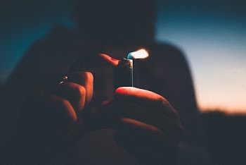 Photo of Person Holding Lighter