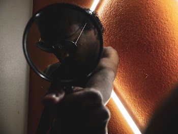 Photo of Person Holding Magnifying Glass