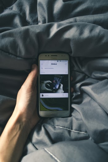 Photo of Person Holding Phone