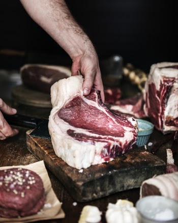 Photo Of Person Holding Raw Meat