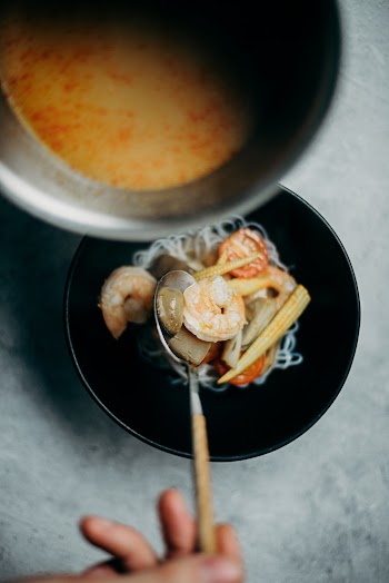 Photo Of Person Holding Spoon 