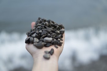 Photo of Person Holding Stones