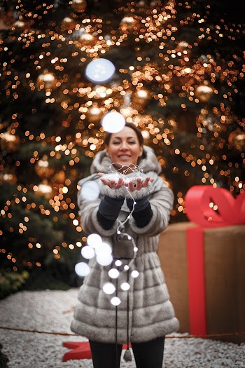 Photo of Person Holding String Lights