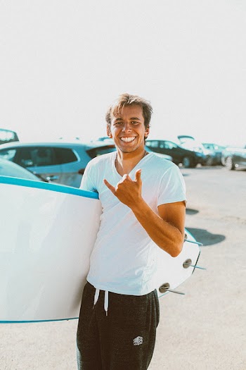 Photo of Person Holding Surfboard