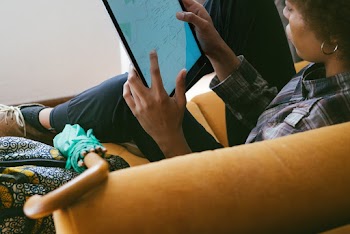 Photo of Person Holding Tablet