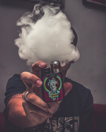 Photo Of Person Holding Vape