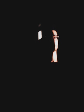 Photo of Person In A Dark Room