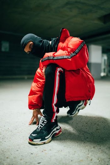 photo of person kneeling on one foot